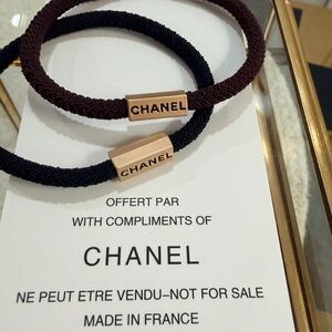 CHANEL Beaute Black and Chocolate Brown Hair Tie Duo with matte gold Chanel Logo